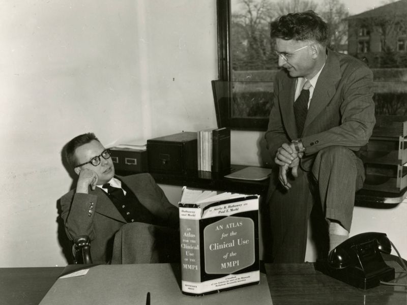 Starke Hathaway with Paul Meehl and a copy of MMPI book