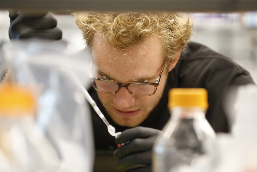 Jake Kircher conducts a benchtop molecular biology experiment.