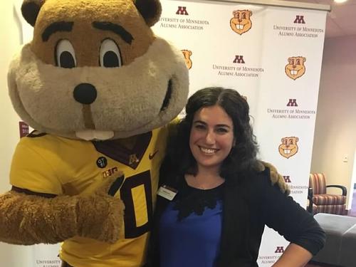 Person posing next to Goldy Gopher